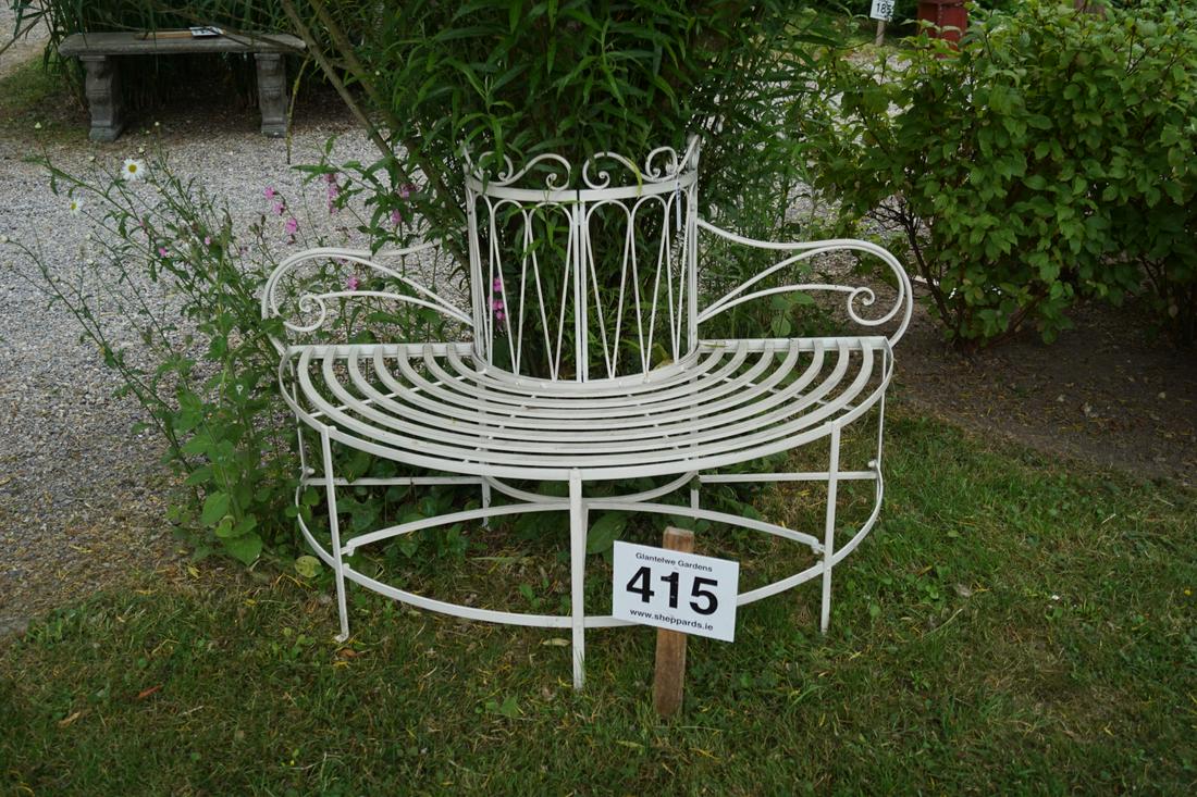 METAL GARDEN TREE BENCH: of semi-elliptical form, raised on scroll legs. 80 cm. high; 150 cm. wide Approximate Time: 10:12 Lot No: 415 Category: Garden & Decorative Objects