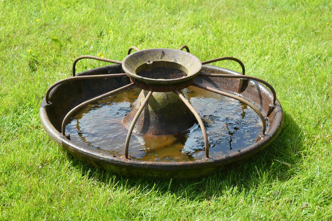 19TH-CENTURY CAST IRON PIG FEEDER: of circular form. Approximate Time: 10:23 Lot No: 427 Category: Garden & Decorative Objects