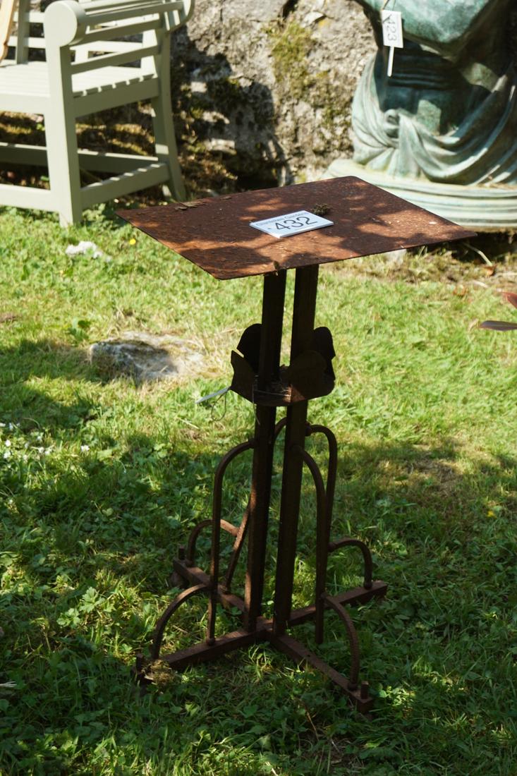 19TH-CENTURY CAST IRON PLANT STAND: the rectangular top, raised on a square pillared stem and splayed square pod with quadrant brackets. Approximate Time: 10:27 Lot No: 432 Category: Garden & Decorative Objects