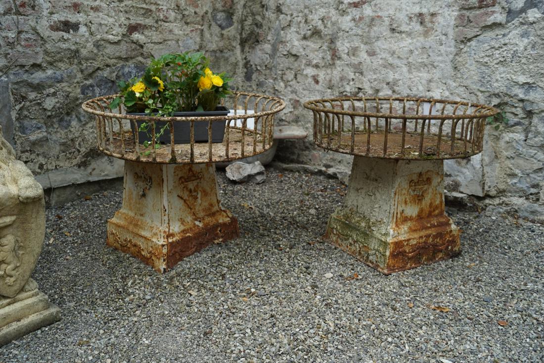 PAIR OF CAST IRON FEEDING TROUGHS: each of circular flowerhead form, with railed outflowing sides. 20 cm. high; 80 cm. diameter Approximate Time: 10:42 Lot No: 448 Category: Garden & Decorative Objects