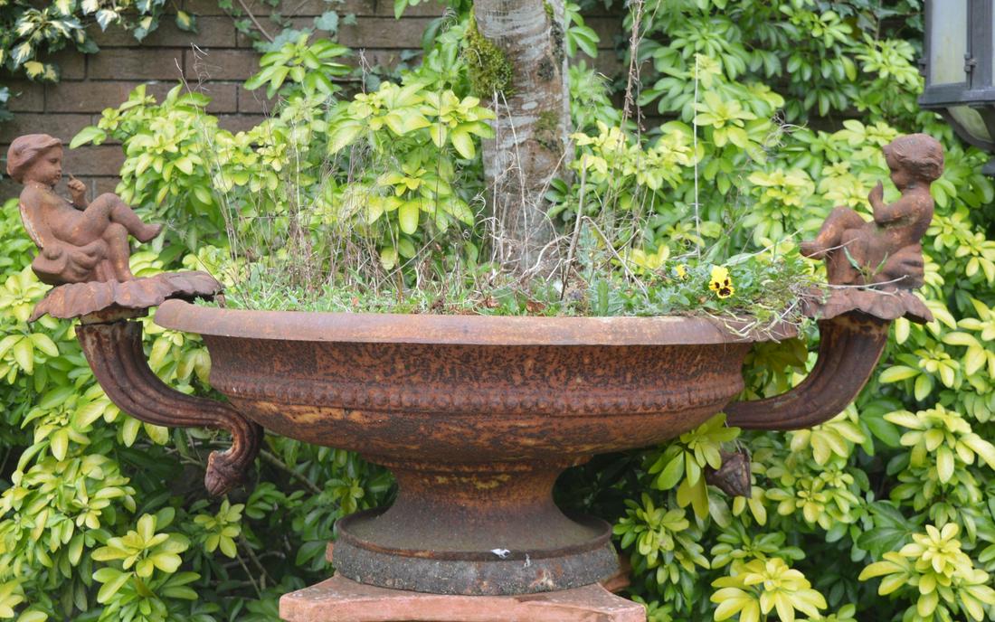 19TH-CENTURY CAST IRON CENTREPIECE: of rectangular form surmounted by cherubs. 60 cm. high; 130 cm. wide; 90 cm. deep Approximate Time: 10:48 Lot No: 455 Category: Garden & Decorative Objects