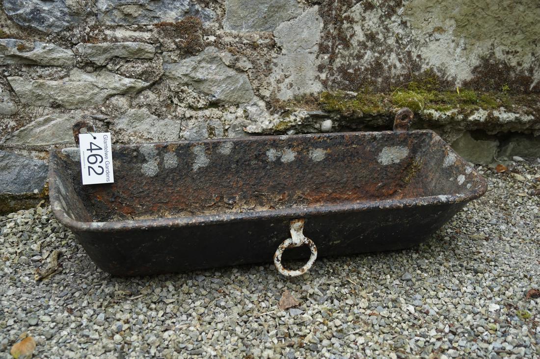 WALL MOUNTED CAST IRON EQUINE FEEDER: rectangular in shape with rounded corners to the fore, furnished with a ring handle. 90 cm. wide; Approximate Time: 10:54 Lot No: 462 Category: Garden & Decorative Objects