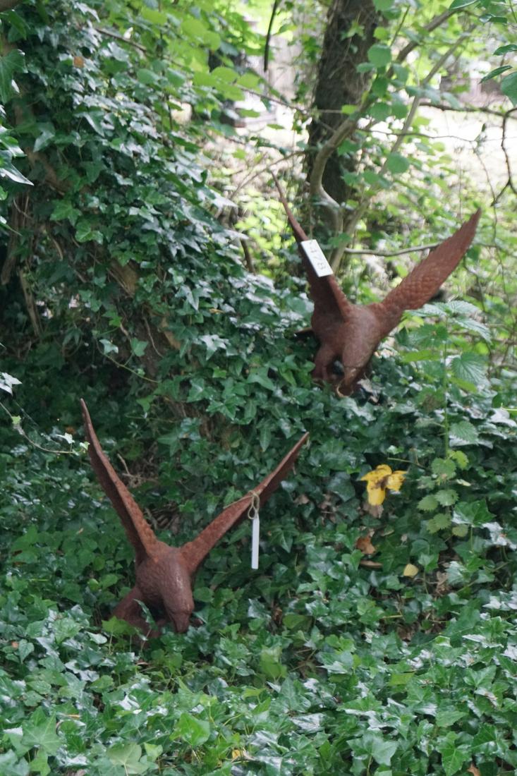 PAIR OF LARGE WING-SPREAD CAST IRON EAGLES: each perched on a rocky mound. Approximate Time: 11:09 Lot No: 478 Category: Garden & Decorative Objects