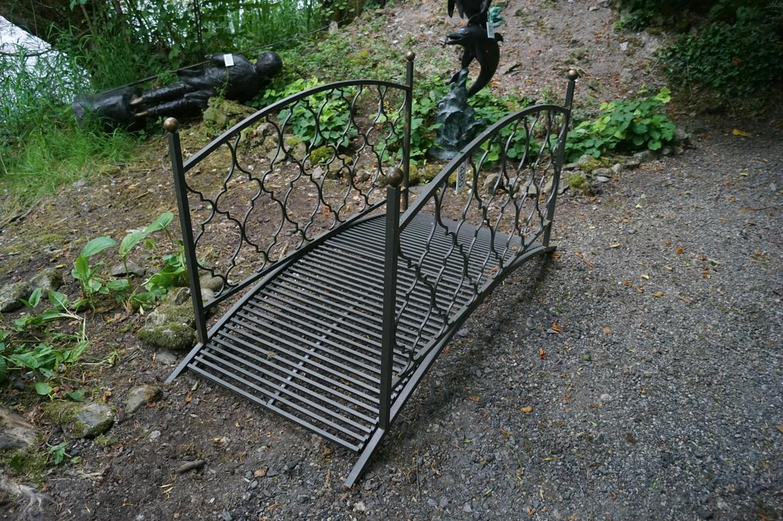 PAINTED METAL BRIDGE: with arched panelled sides. 92 cm. high; 170 cm. wide; 85 cm. deep Approximate Time: 11:11 Lot No: 480 Category: Garden & Decorative Objects
