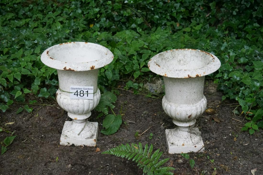 PAIR OF GEORGIAN CAST IRON URNS: each of vase shape, raised on a turned stem and square base. 43 cm. high; 33 cm. diameter Approximate Time: 11:12 Lot No: 481 Category: Garden & Decorative Objects
