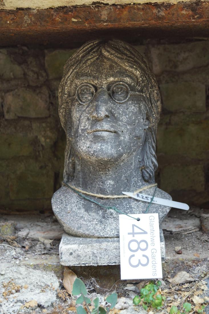 MOULDED STONE GARDEN ORNAMENT: Head of John Lennon. 37 cm. high; 16 cm. wide Approximate Time: 11:13 Lot No: 483 Category: Garden & Decorative Objects