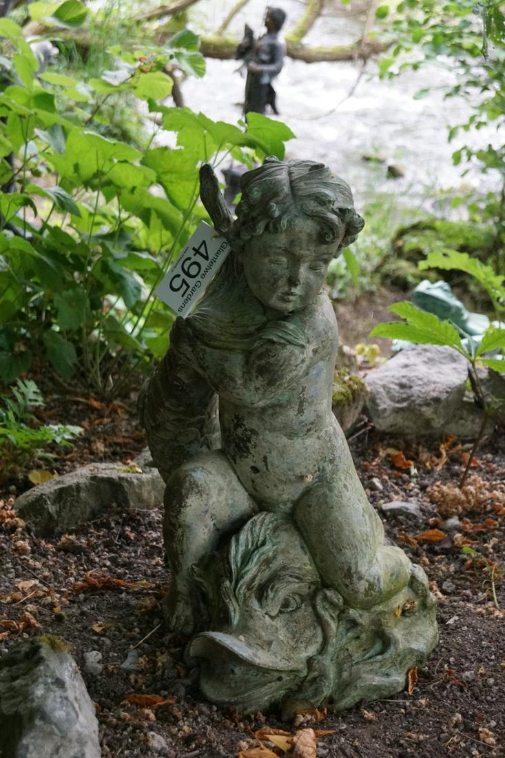 BRONZE SCULPTURAL GARDEN FOUNTAIN: depicting a cherub holding a fish. 60 cm. high; 45 cm. wide; Approximate Time: 11:24 Lot No: 495 Category: Garden & Decorative Objects