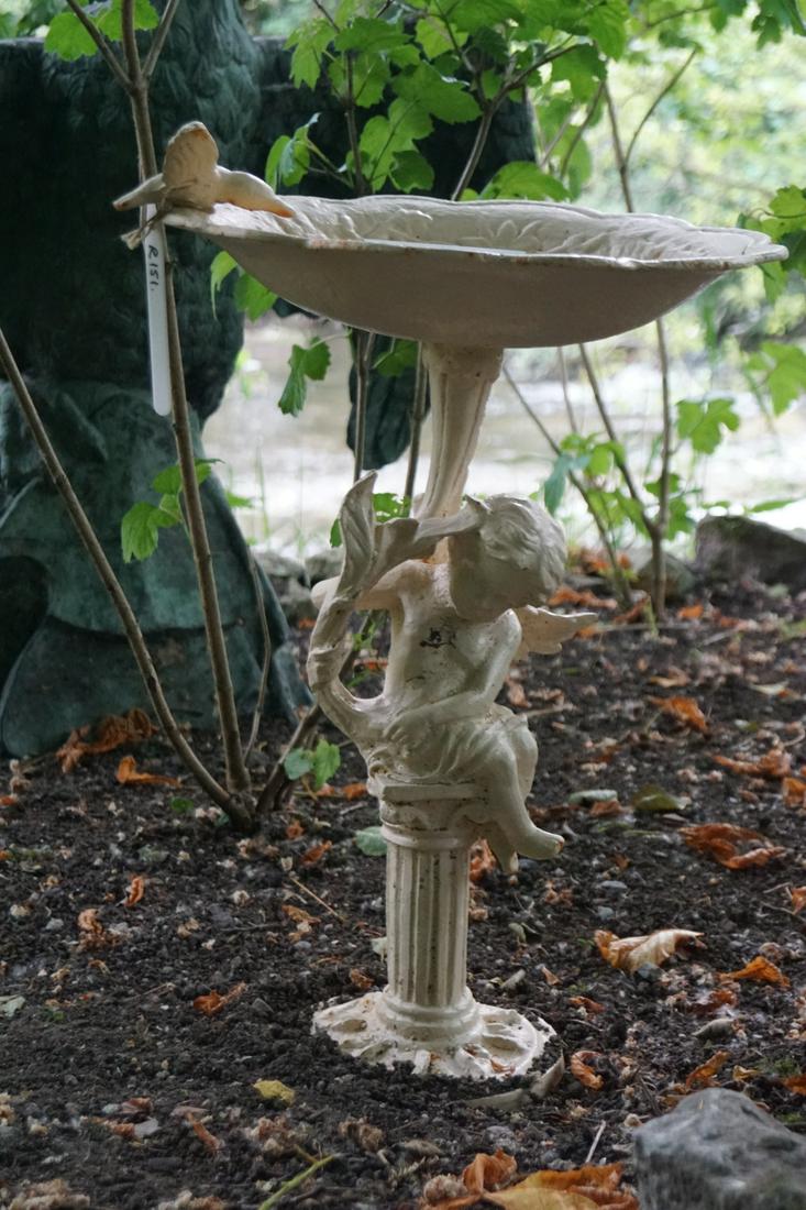 CAST IRON BIRD BATH: supported on a cherub stem and circular base. 60 cm. high; 40 cm. wide Approximate Time: 11:25 Lot No: 496 Category: Garden & Decorative Objects