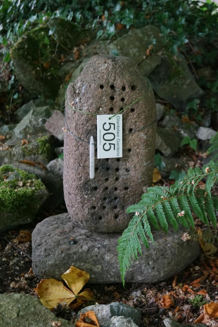 19TH-CENTURY CUT STONE GARDEN FEATURE: raised on a stone base. 54 cm. high; Approximate Time: 11:33 Lot No: 505 Category: Garden & Decorative Objects