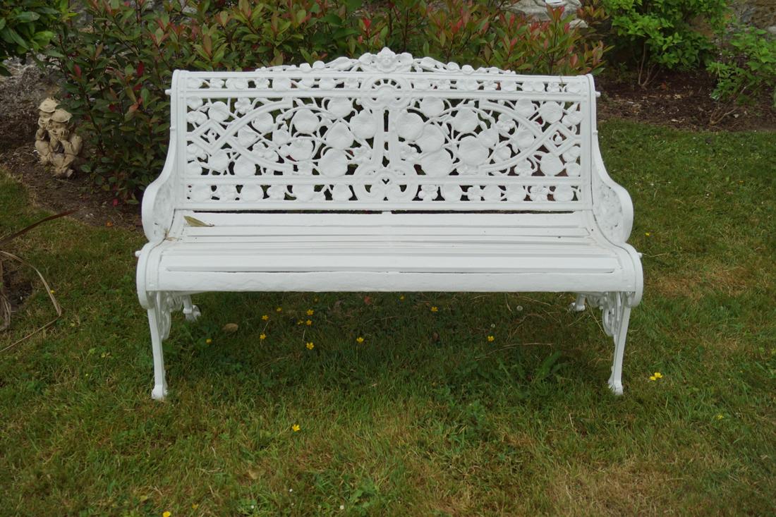 CAST IRON COALBROOKDALE STYLE GARDEN BENCH: with nasturtium decorated back, raised on scroll ends. Approximate Time: 11:35 Lot No: 507 Category: Garden & Decorative Objects