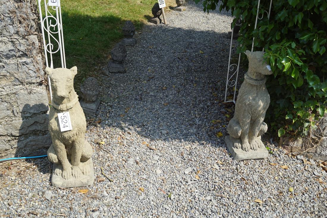 PAIR OF MOULDED STONE HUNTING DOGS: each resting on its hind quarters. 76 cm. high Approximate Time: 11:50 Lot No: 524 Category: Garden & Decorative Objects