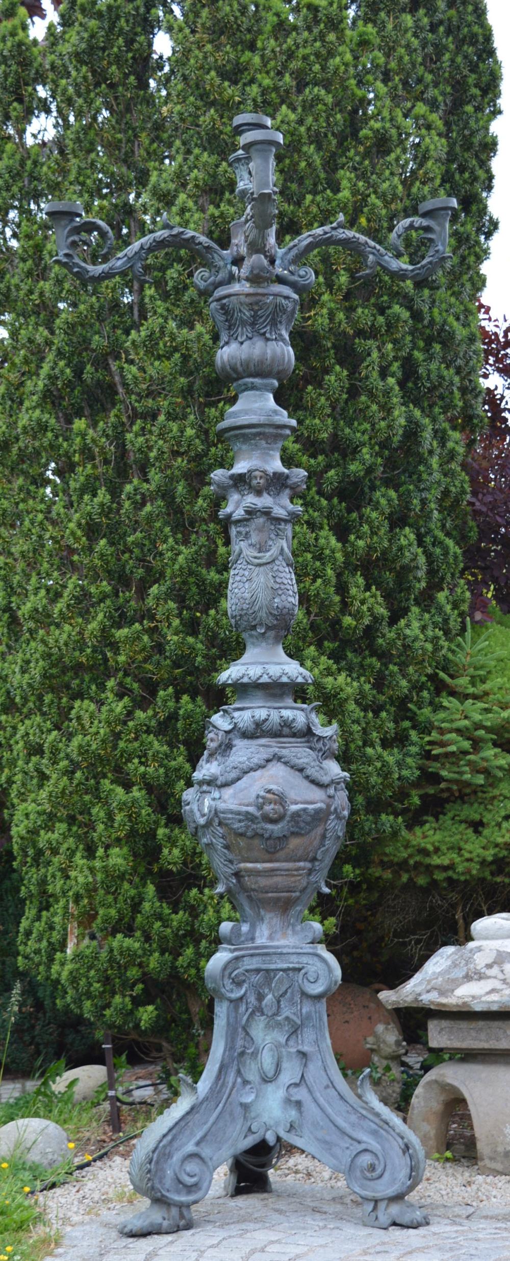 LARGE BRONZE STREET LAMP: of 4 scroll lights, the stem decorated with caryatids, raised on outswept claw feet. 300 cm. high; 82 cm. wide; Approximate Time: 12:00 Lot No: 535 Category: Garden & Decorative Objects