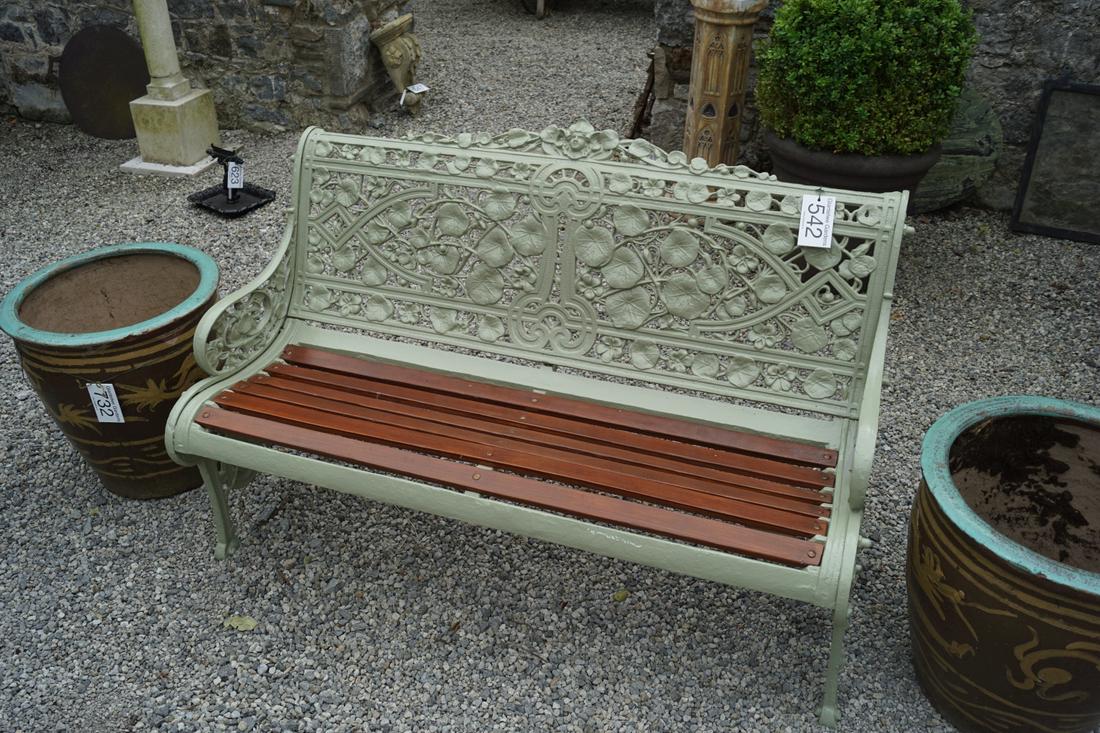 CAST IRON COALBROOKDALE STYLE GARDEN BENCH: with nasturtium decorated back, raised on scroll ends. 90 cm. high; 130 cm. wide Approximate Time: 12:06 Lot No: 542 Category: Garden & Decorative Objects