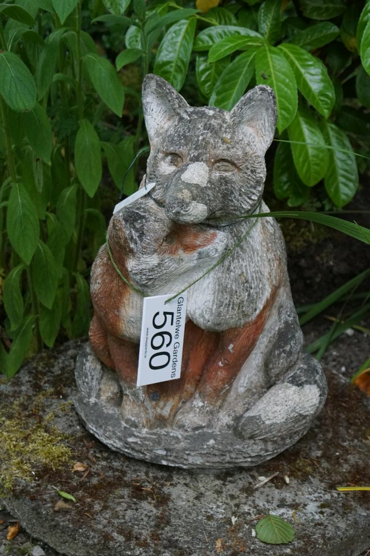 WEATHERED MOULDED STONE GARDEN FIGURE: of a fox, seated on a moss covered circular plinth. 63 cm. high; Approximate Time: 12:23 Lot No: 560 Category: Garden & Decorative Objects