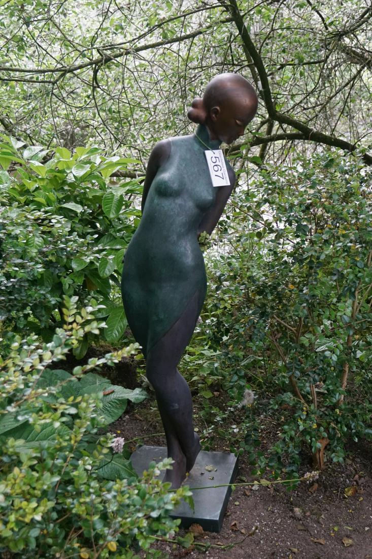 LARGE BRONZE GARDEN SCULPTURE: Figure of a lady mounted on a square plinth. 135 cm. high; 36 cm. wide; 36 cm. deep Approximate Time: 12:29 Lot No: 567 Category: Garden & Decorative Objects