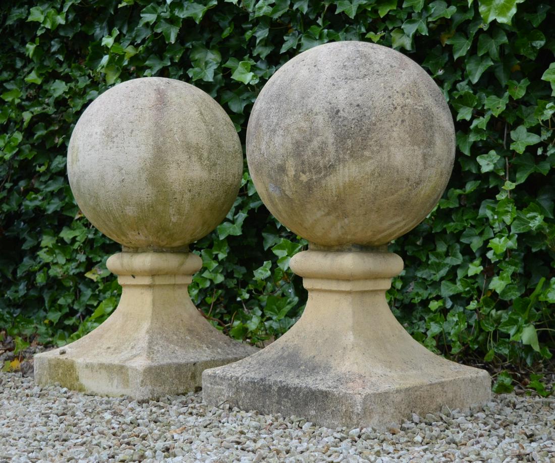PAIR OF ITALIANATE STONE PIER FINIALS: each of spherical form, raised on a square base. 88 cm. high; 44 cm. wide; 44 cm. deep; Approximate Time: 12:39 Lot No: 578 Category: Garden & Decorative Objects