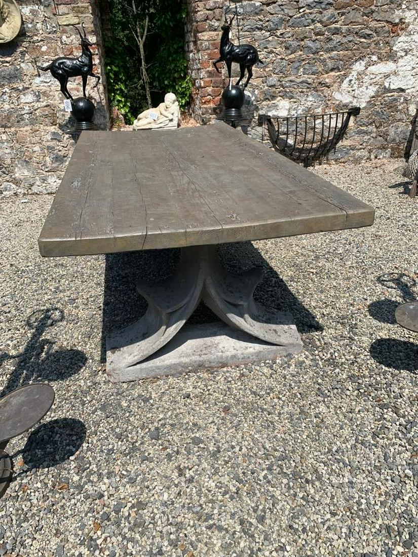 ARCHITECTURAL GARDEN/CONSERVATORY REFECTORY TABLE: the rectangular planked top raised on 18th-century stone ends. 70 cm. high; 240 cm. long Approximate Time: 12:40 Lot No: 579 Category: Garden & Decorative Objects
