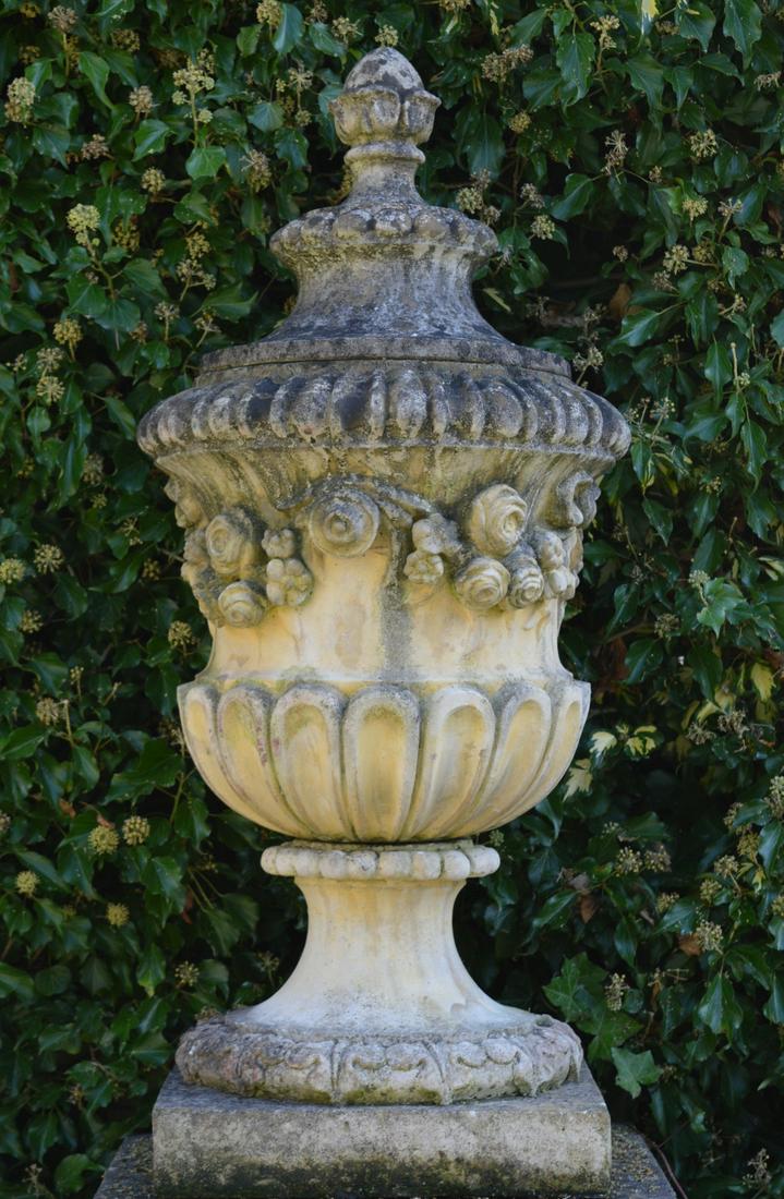LARGE MOULDED STONE GARDEN CENTREPIECE: of vase shape, raised on a circular stem and square base. 115 cm. high; 55 cm. wide; 55 cm. deep Approximate Time: 12:58 Lot No: 599 Category: Garden & Decorative Objects