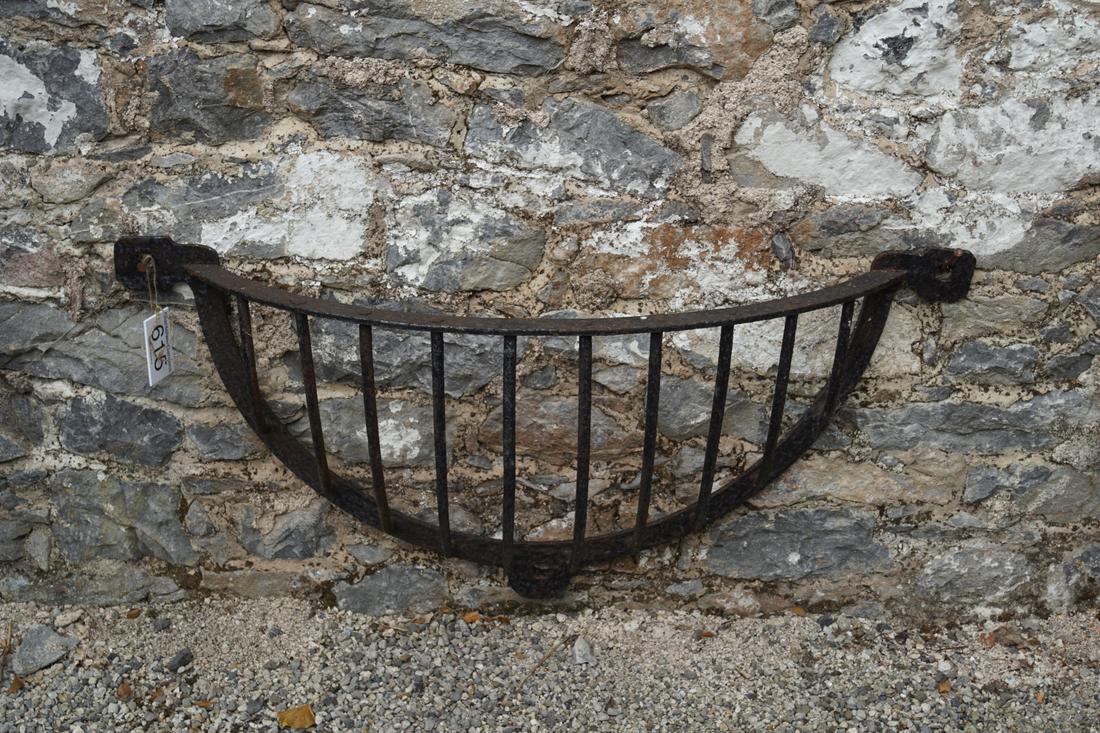 LATE 18TH-CENTURY OPEN IRONWORK HORSE FEEDER: wall-mounted. 28 cm. high; 85 cm. wide; 32 cm. deep Approximate Time: 14:12 Lot No: 615 Category: Garden & Decorative Objects