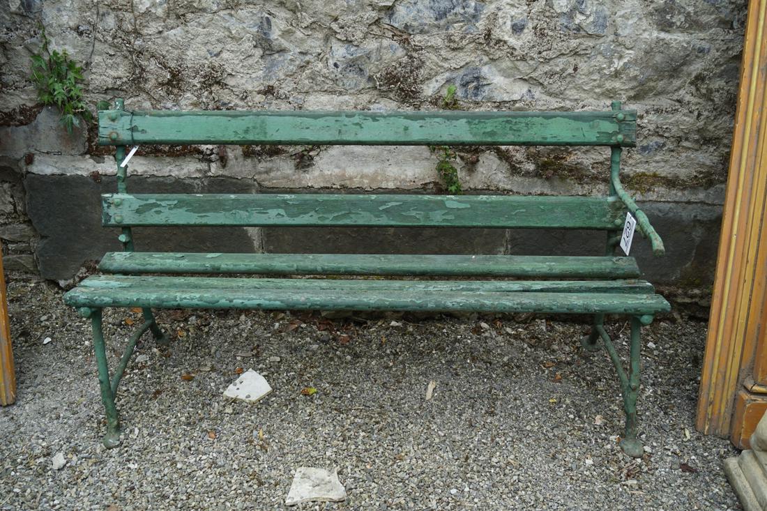 VICTORIAN CAST IRON GARDEN SEAT: raised on scroll ends. 84 cm. high; 156 cm. wide; Approximate Time: 14:23 Lot No: 627 Category: Garden & Decorative Objects