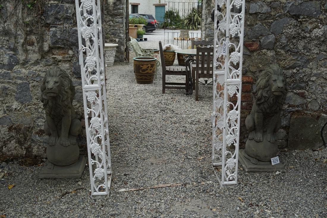 PAIR OF LARGE COMPOSITE STONE LIONS: each resting on a ball. 100 cm. high; Approximate Time: 14:25 Lot No: 629 Category: Garden & Decorative Objects