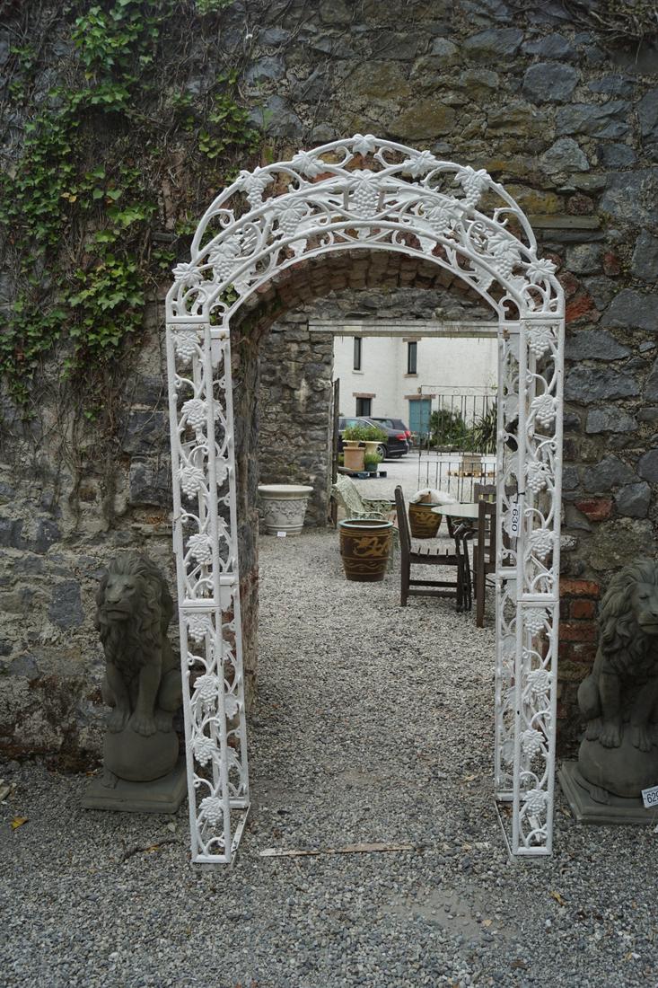 ORNATE CAST IRON GARDEN ARCH: with vine leaf and grape decoration. 232 cm. high; 120 cm. wide; 40 cm. deep Approximate Time: 14:26 Lot No: 630 Category: Garden & Decorative Objects