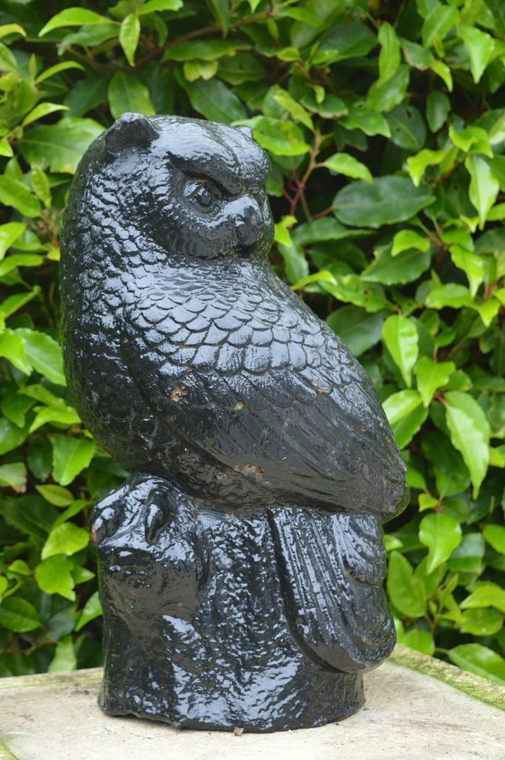 CAST IRON MODEL: of an owl. 35 cm. high; 18 cm. wide Approximate Time: 14:39 Lot No: 645 Category: Garden & Decorative Objects
