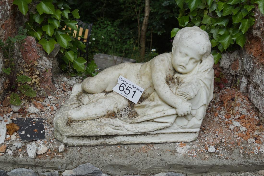 18TH/19TH-CENTURY ITALIAN MARBLE SCULPTURE: Figure of a reclining putto resting on a canape. 60 cm. long Approximate Time: 14:45 Lot No: 651 Category: Garden & Decorative Objects