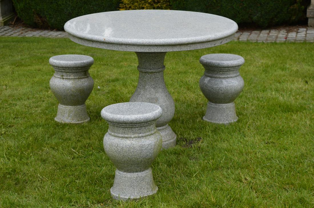 DESIGNER GRANITE STONE PATIO TABLE: and 3 matching stools. 76 cm. high; 100 cm. wide; Approximate Time: 14:59 Lot No: 667 Category: Garden & Decorative Objects