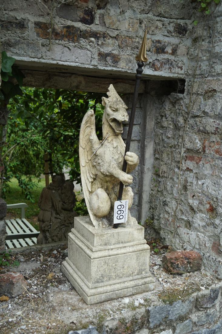 STONE GARDEN SCULPTURE: Figure of a mythical dragon supported on a square plinth. 90 cm. high; 31 cm. wide; 31 cm. deep Approximate Time: 15:01 Lot No: 669 Category: Garden & Decorative Objects