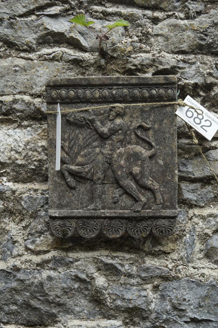 CLASSICAL WALL-MOUNTED PLAQUE: Moulded stone, figure taming a bull. 35 cm. high; 30 cm. wide; Approximate Time: 15:12 Lot No: 682 Category: Garden & Decorative Objects