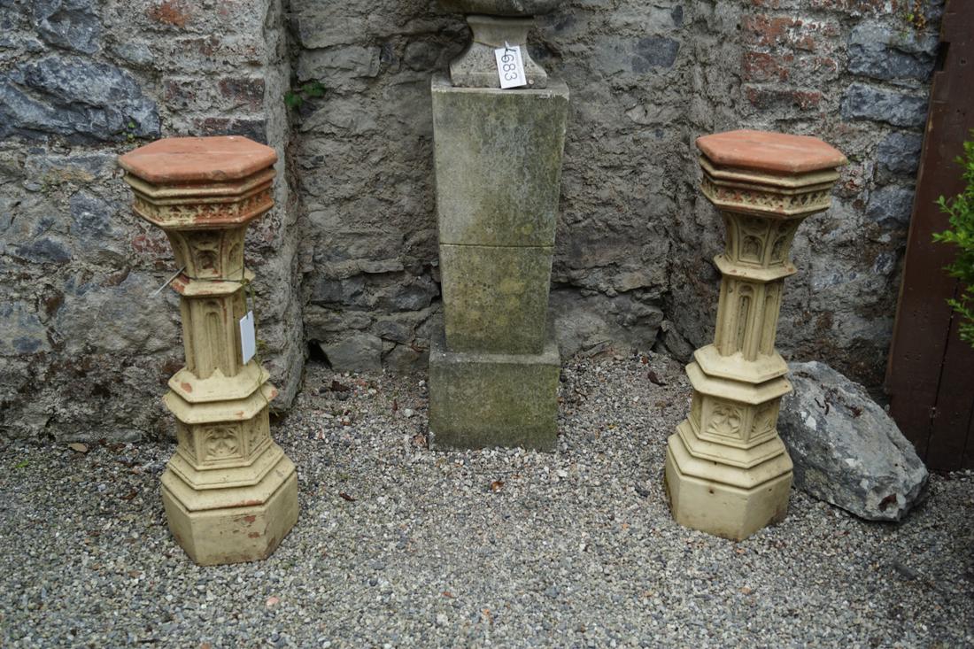 PAIR OF TERRACOTTA GARDEN PEDESTALS: each with a hexagonal shaped top, above a Gothic tracery and arched panelled stem. 90 cm. high; Approximate Time: 15:14 Lot No: 684 Category: Garden & Decorative Objects