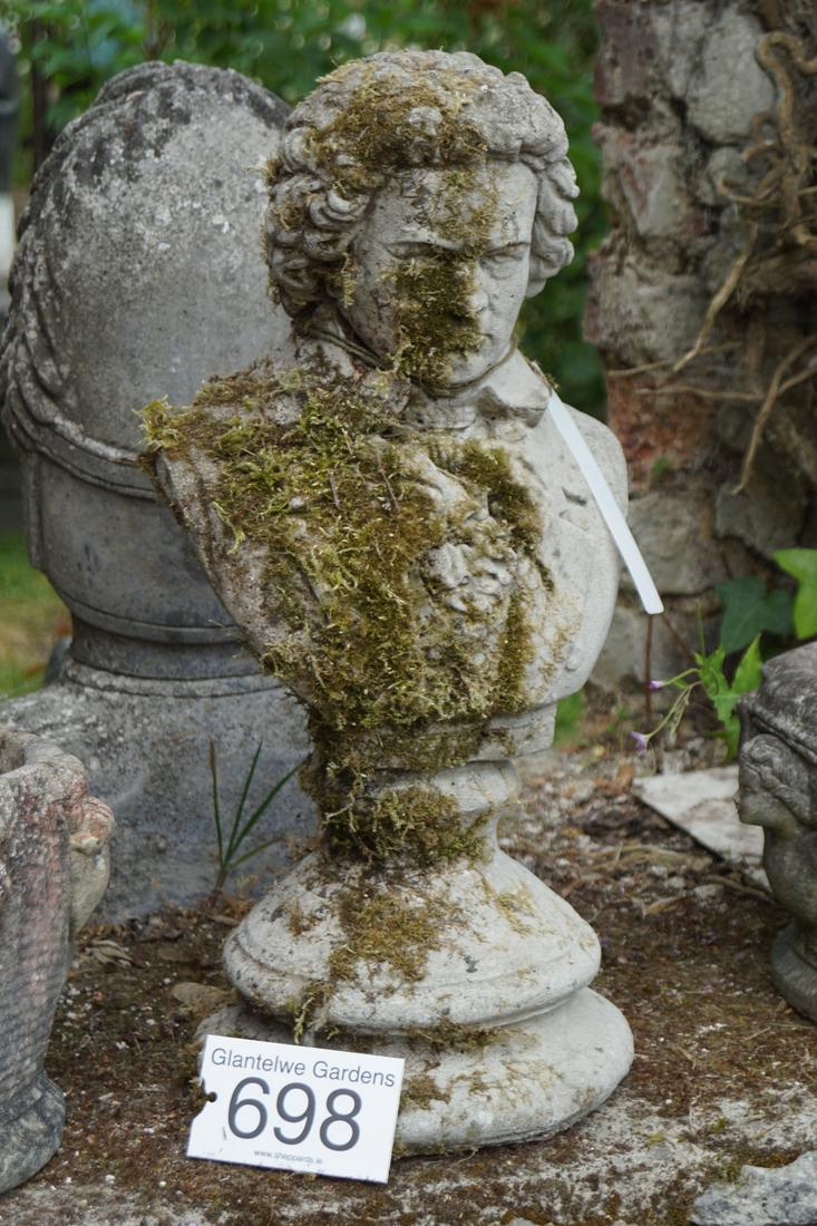 GARDEN BUST OF MOZART: Weathered moulded stone. 64 cm. high; Approximate Time: 15:27 Lot No: 698 Category: Garden & Decorative Objects