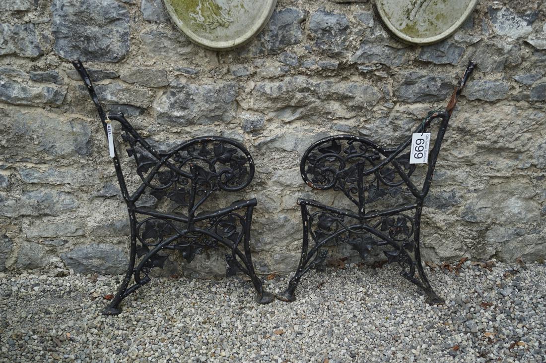 PAIR OF CAST IRON SEAT ENDS: each with ivy leaf decoration. 90 cm. high; 58 cm. wide Approximate Time: 15:28 Lot No: 699 Category: Garden & Decorative Objects