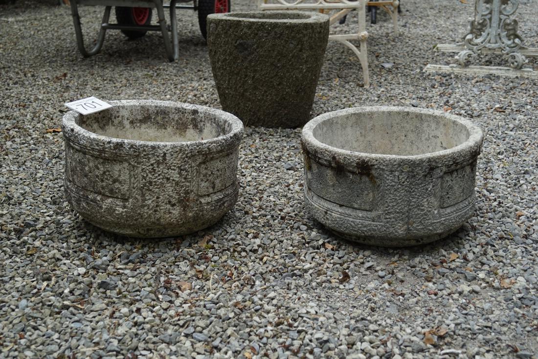 PAIR OF WEATHERED GARDEN MOULDED GRANITE PLANTERS: each of circular form with panelled sides. 23 cm. high; 38 cm. wide; Approximate Time: 15:30 Lot No: 701 Category: Garden & Decorative Objects
