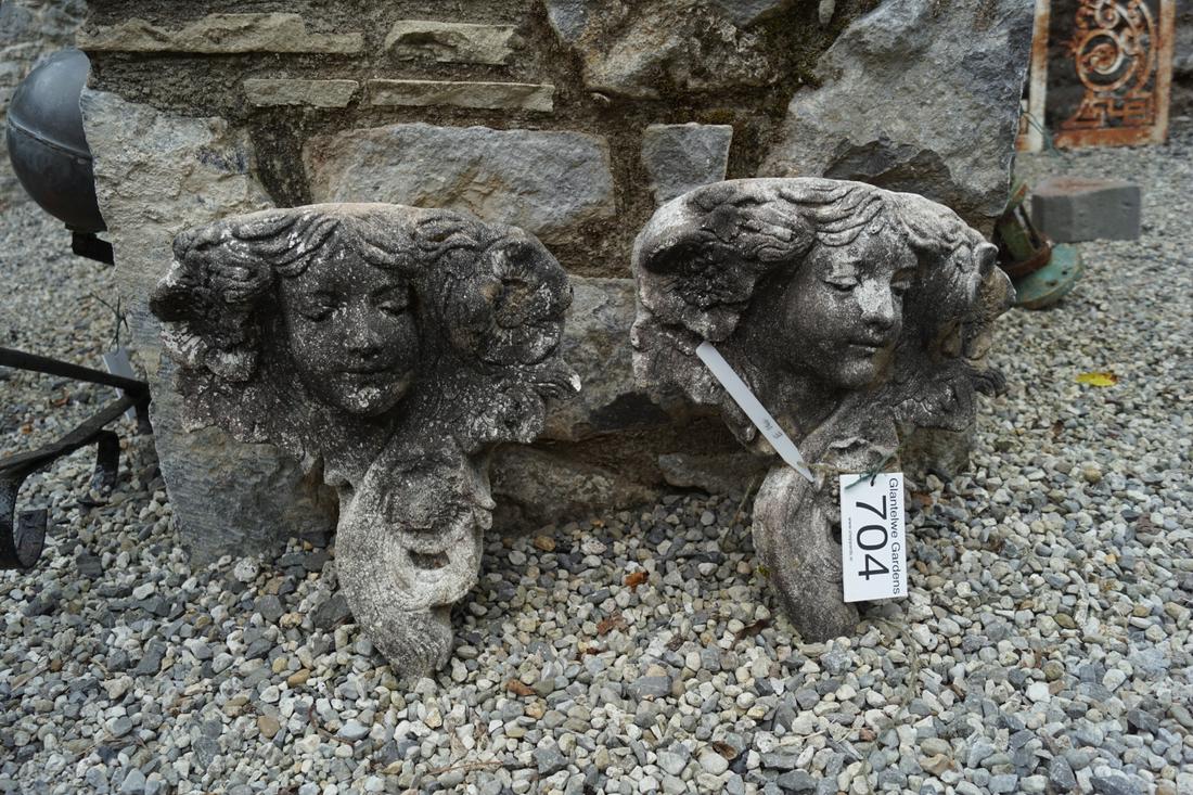 PAIR OF MOULDED STONE GARDEN PLAQUES: each a figure of a young girl. 40 cm. high; 34 cm. wide; Approximate Time: 15:32 Lot No: 704 Category: Garden & Decorative Objects