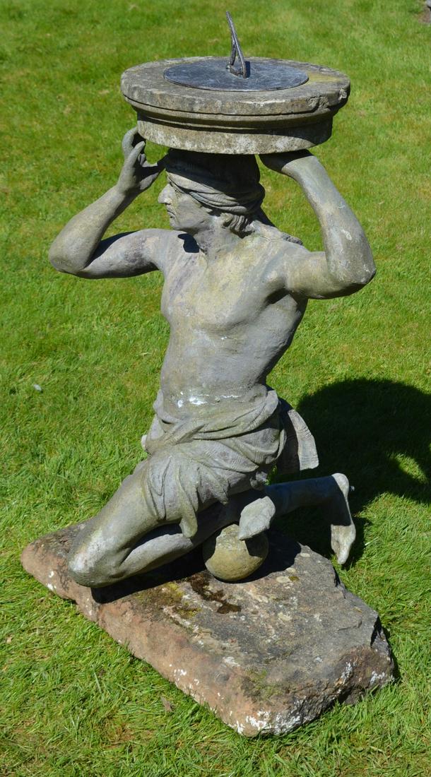 IMPORTANT 19TH-CENTURY SUNDIAL: supported on a lead kneeling figure. 140 cm. high; 80 cm. wide Approximate Time: 15:43 Lot No: 716 Category: Garden & Decorative Objects