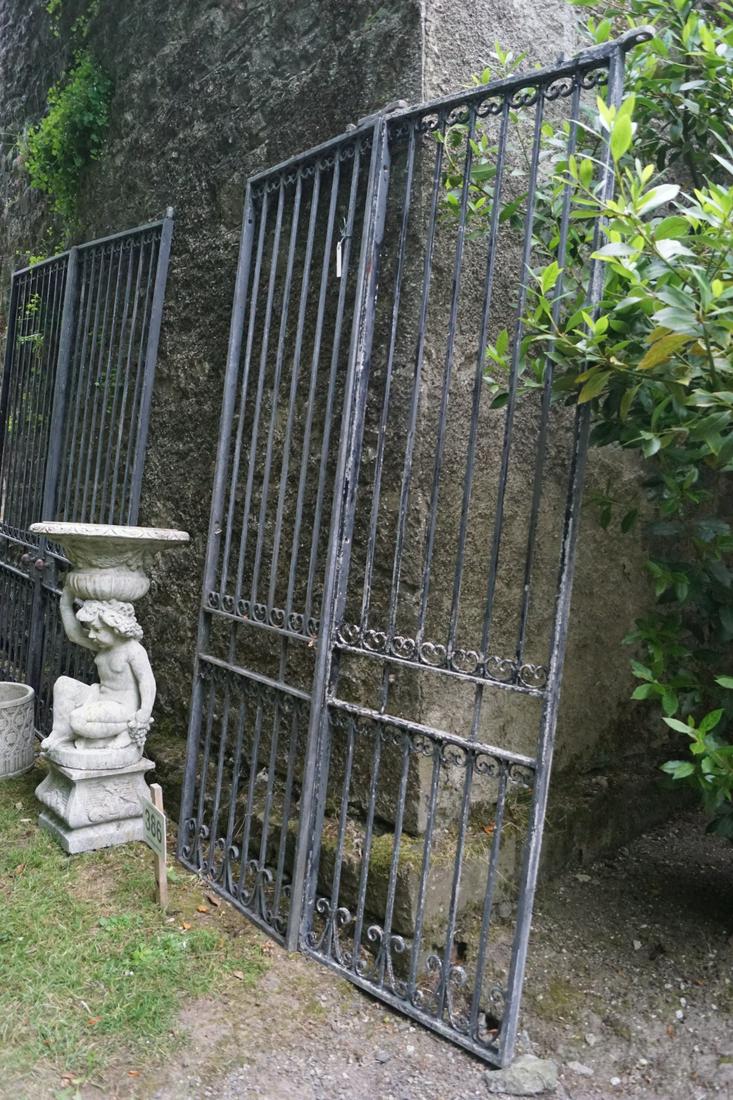 PAIR OF WROUGHT IRON GARDEN GATES: each with scroll openwork and railed panels. 186 cm. high; 184 cm. wide; Approximate Time: 15:54 Lot No: 728 Category: Garden & Decorative Objects
