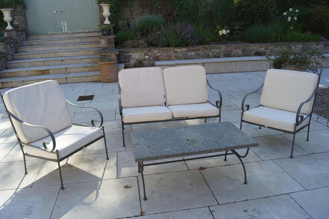 NEPTUNE GARDEN PATIO LOUNGE SUITE: Comprising settee and two armchairs. 90 cm. high; 140 cm. wide; 85 cm. deep; Approximate Time: 16:16 Lot No: 753 Category: Garden & Decorative Objects