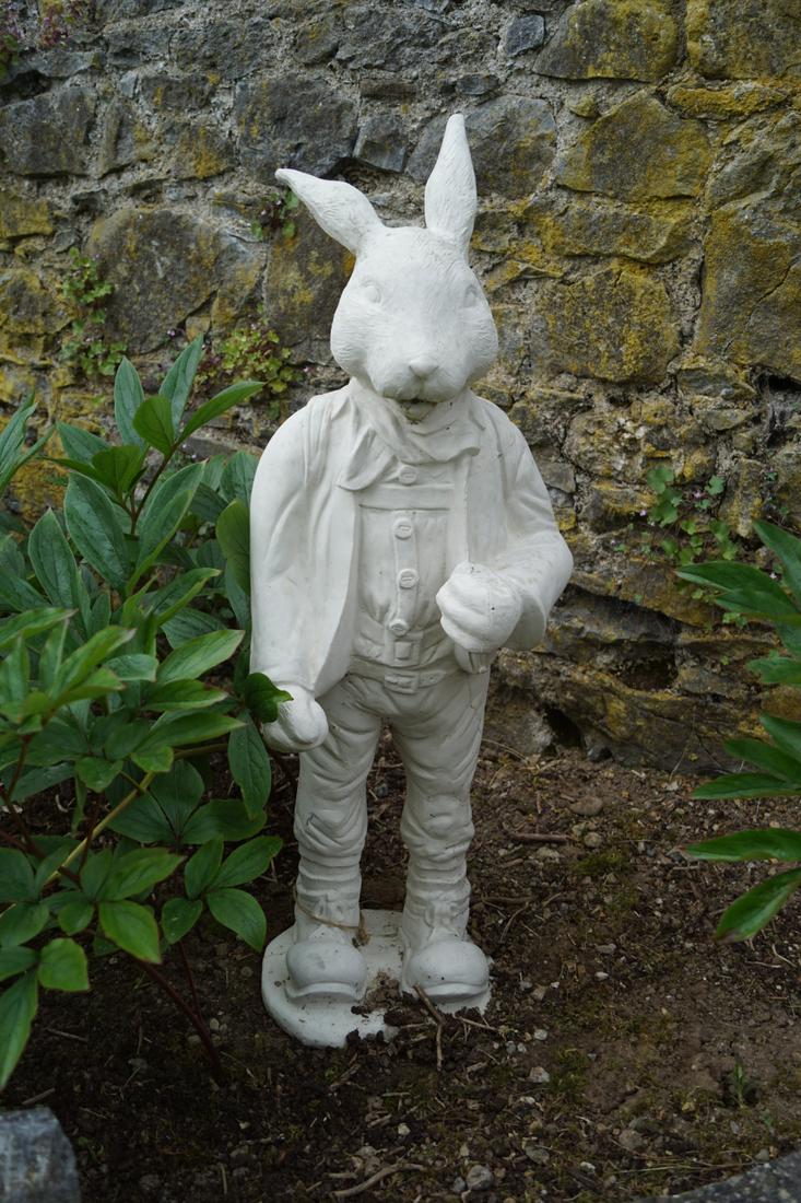 MOULDED STONE GARDEN SCULPTURE: Figure of a clothed rabbit. 80 cm. high; 30 cm. wide Approximate Time: 16:32 Lot No: 770 Category: Garden & Decorative Objects