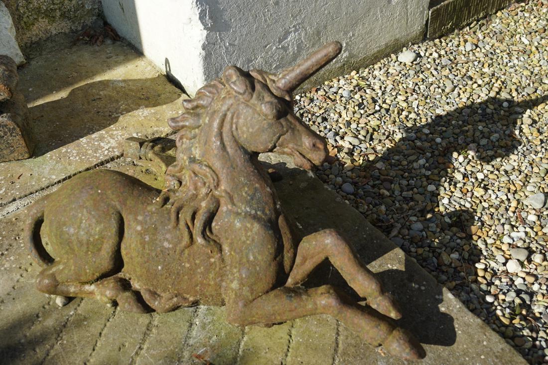 PAIR OF 19TH-CENTURY IRON FOOT SCRAPERS: Fronted by a lion and a unicorn. 34 cm. high; 70 cm. wide; 60 cm. deep; 43 / 60 / 30 Approximate Time: 16:37 Lot No: 776 Category: Garden & Decorative Objects