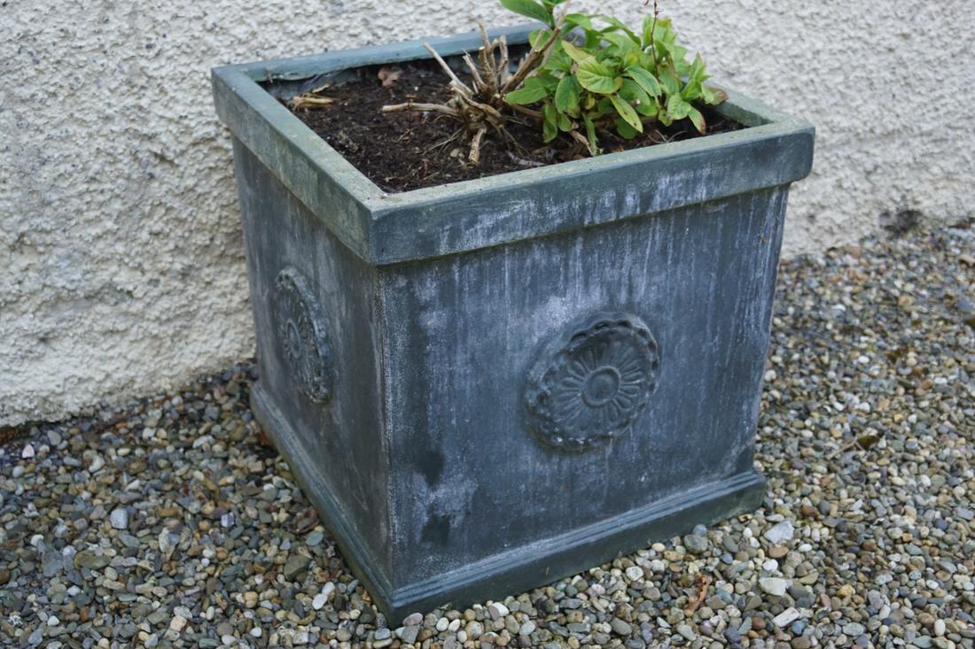PAIR OF COMPOSITE PLANTERS AND PLANTS: each of square form with paterae decoration. 45 cm. high; 45 cm. wide; 45 cm. deep; Approximate Time: 16:40 Lot No: 779 Category: Garden & Decorative Objects