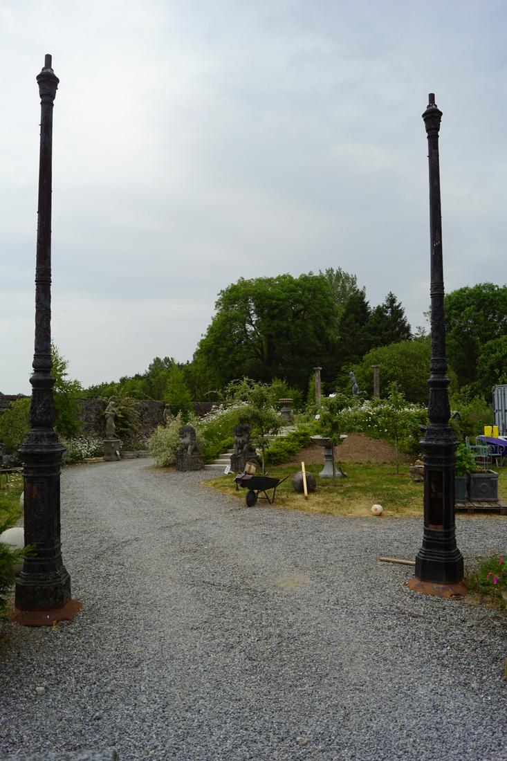 PAIR LARGE 19TH-CENTURY CAST IRON LAMP STANDARDS: each with an acanthus leaf decorated fluted stem, on a panelled square base. 480 cm. high Approximate Time: 16:53 Lot No: 794 Category: Garden & Decorative Objects