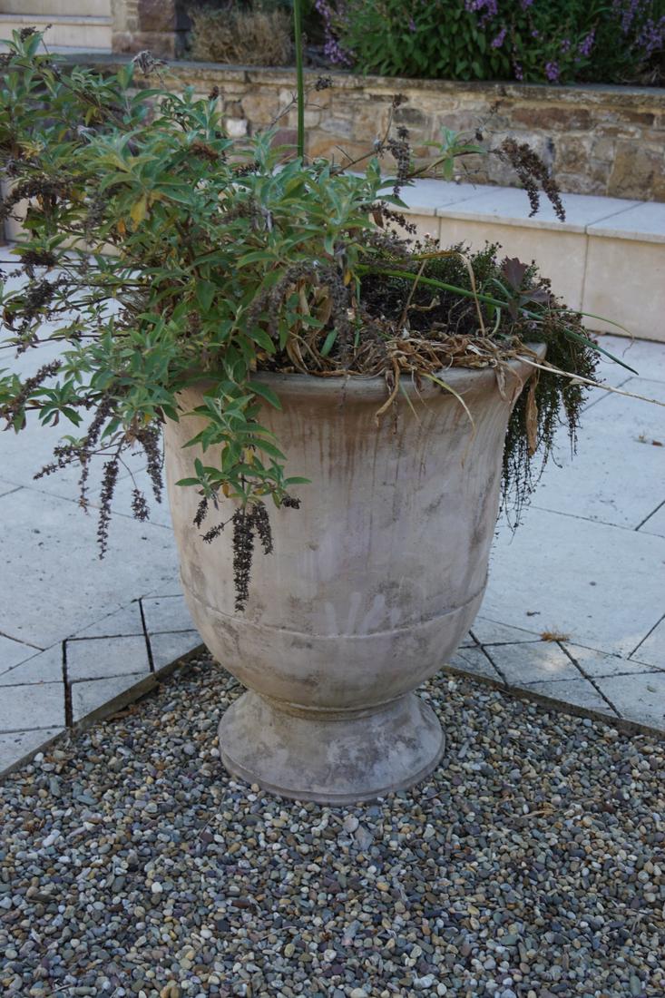 PAIR OF TERRACOTTA GARDEN URNS: each of circular tapered form with a fluted rim, raised on a circular foot. 72 cm. high; 62 cm. in diameter; Approximate Time: 17:16 Lot No: 819 Category: Garden & Decorative Objects