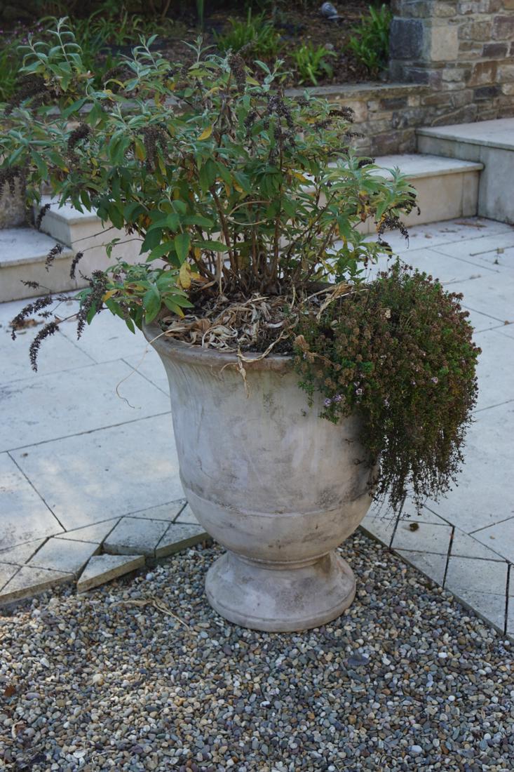PAIR OF TERRACOTTA GARDEN URNS: each of circular tapered form with a fluted rim, raised on a circular foot. 74 cm. high; 62 cm. in diameter; Approximate Time: 17:19 Lot No: 823 Category: Garden & Decorative Objects
