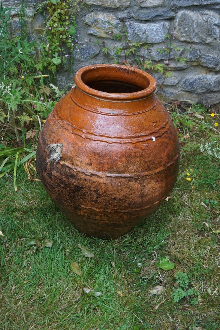 LARGE TERRACOTTA OIL JAR: with glazed neck and shoulder. 65 cm. high; 50 cm. wide Approximate Time: 17:20 Lot No: 824 Category: Garden & Decorative Objects