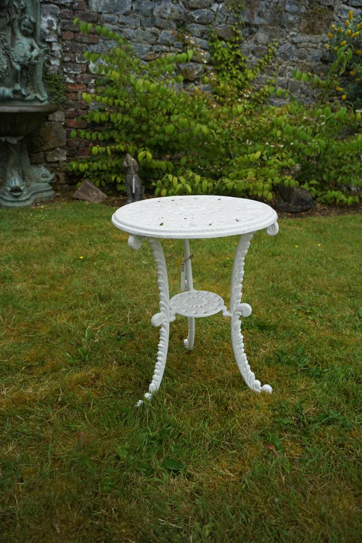 CAST IRON TWO-TIER PATIO DRINKS TABLE: Cast iron two-tier patio drinks table. 58 cm. high; 45 cm. wide Approximate Time: 17:27 Lot No: 831 Category: Garden & Decorative Objects