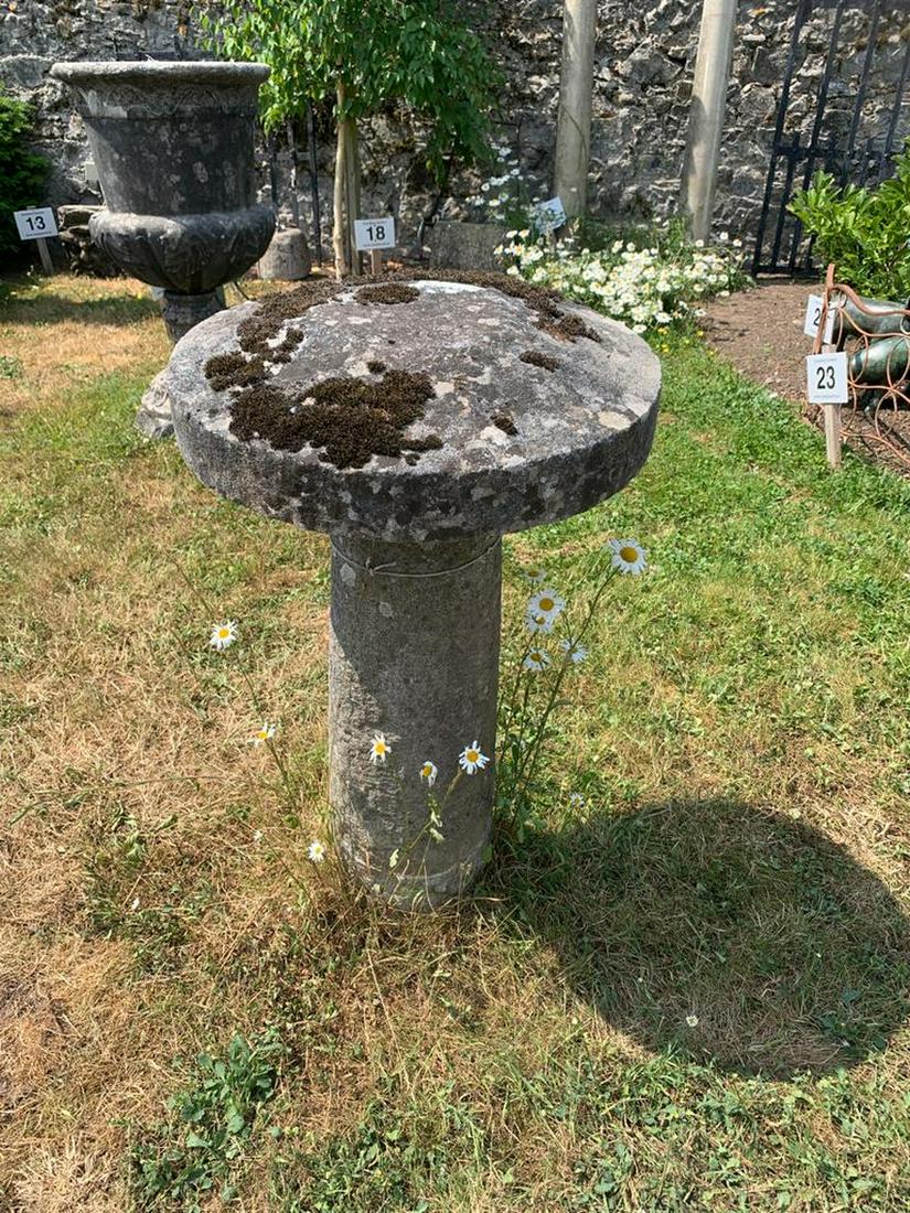 18TH-CENTURY STADDLE STONE: of mushroom shape, raised on a tapered and turned stem. 61 cm. high; 54 cm. in diameter; Approximate Time: 17:43 Lot No: 849 Category: Garden & Decorative Objects