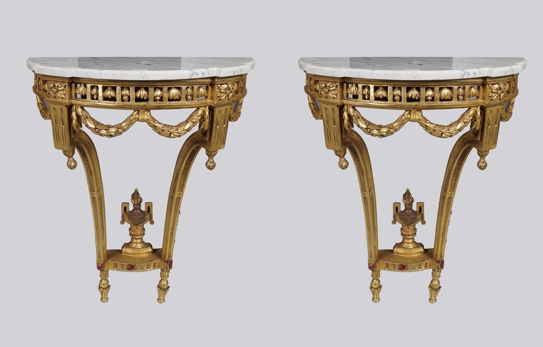PAIR OF GILTWOOD CONSOLE TABLES: each of demi-lune form with shaped white marble top. Approx. 73 cm. high; 50 cm. wide; 25 cm. deep Approximate Time: 11:30 Lot No: 121