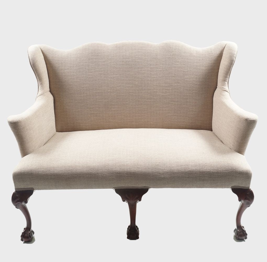 PAIR DUBLIN EDWARDIAN WING-BACKED SETTEES: each raised on scallop shell head cabriole legs to the fore terminating on claw and ball feet. 97 cm. high; 137 cm. wide; 64 cm. deep; Approximate Time: 10:54 Lot No: 75